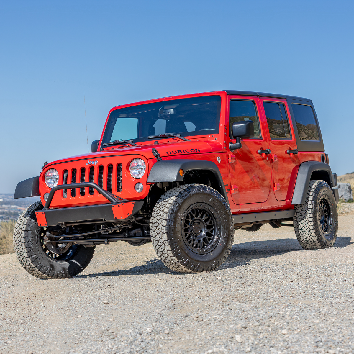 Angled view of the Savvy Offroad Surf & Turf winchless bumper with raw aluminum skin and hoop