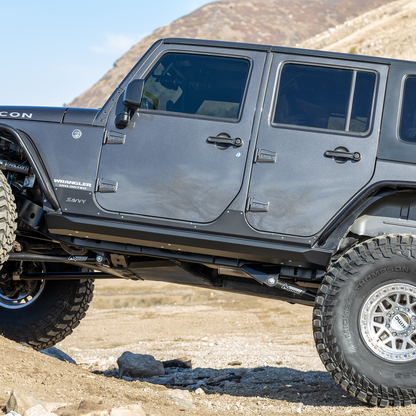 High-clearance weld-on Jeep JKU rock sliders with replaceable outer skin