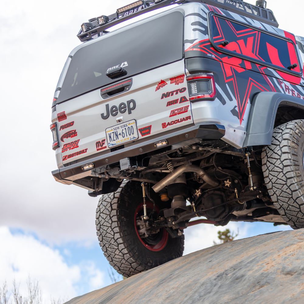 Jeep Gladiator JT with Savvy Legacy OG rear bumper clearing steep rock descent Big 10 departure clearance trail proven