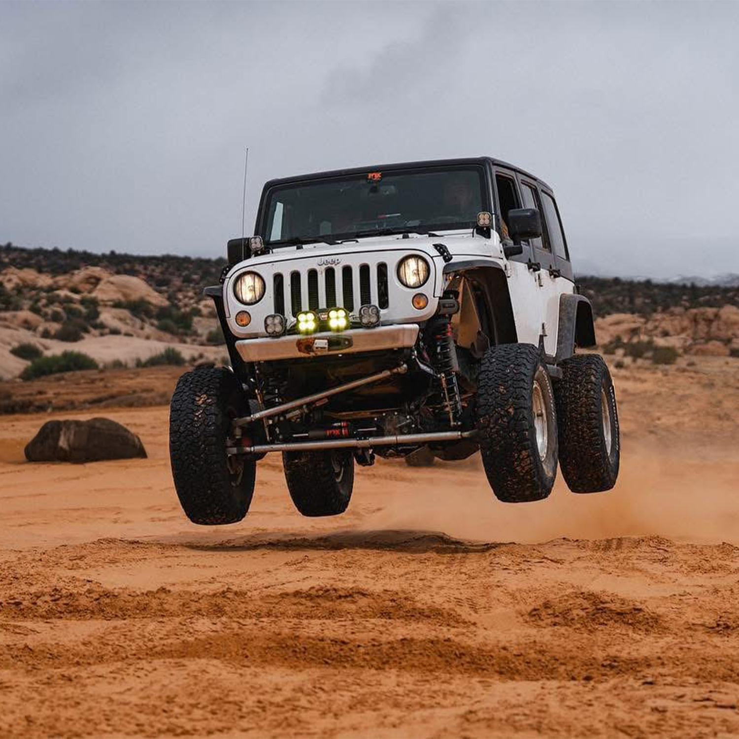 Jeep JK Wrangler with Savvy Legacy front bumper no hoop on rocky trail, King of the Hammers race-proven armor