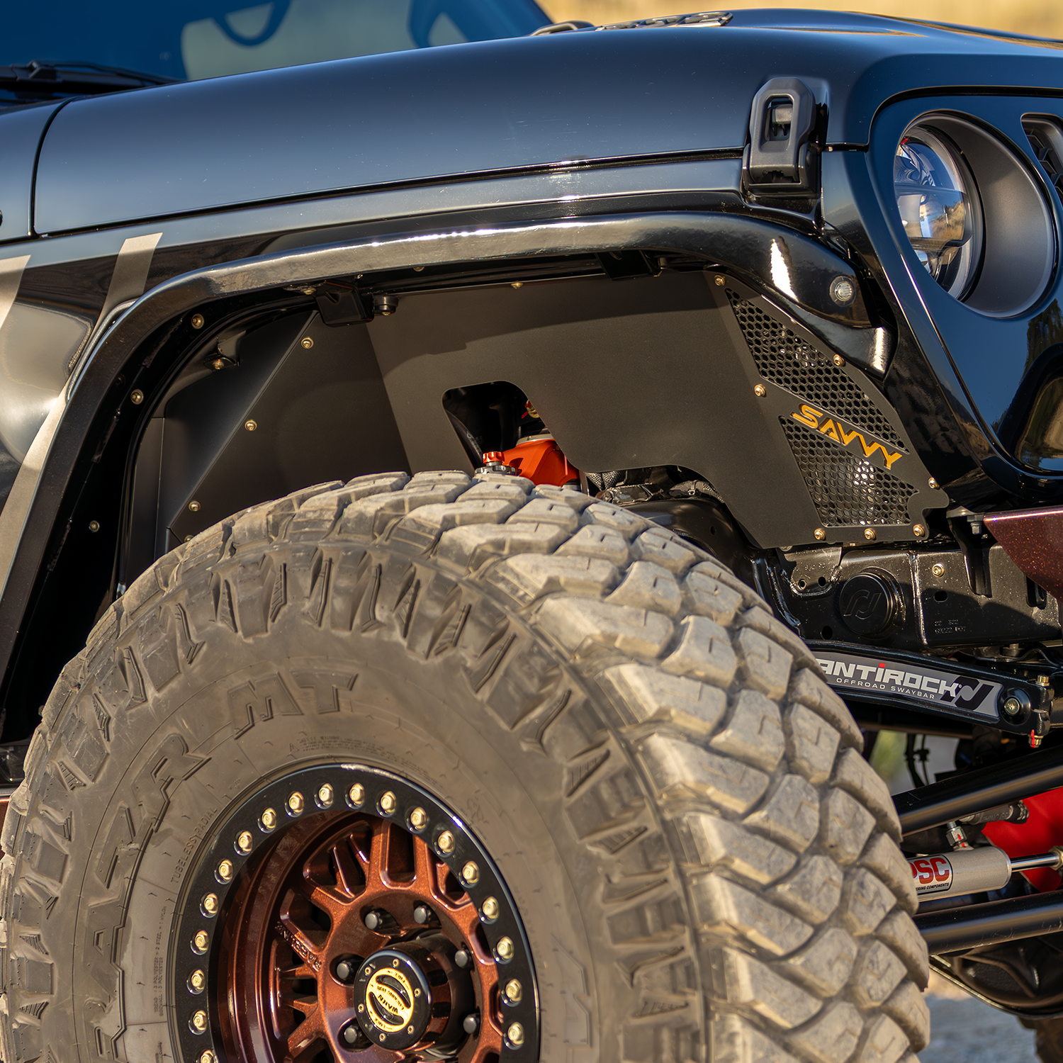 Savvy high clearance aluminum inner fender kit with 40 inch plus tires on Jeep JLU Wrangler, no tire rub at full compression