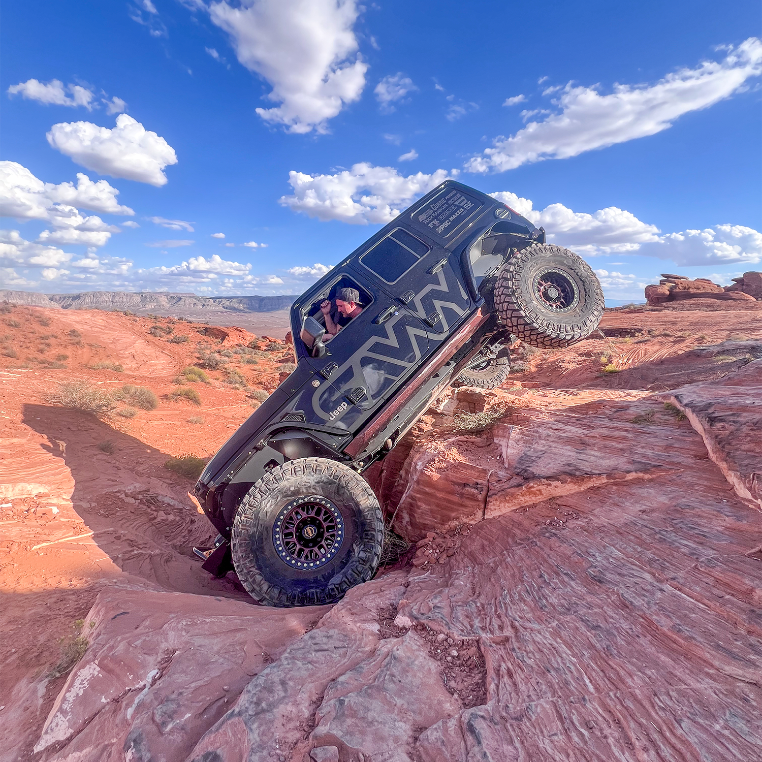 Jeep Wrangler JLU using Savvy KRAWLER ELITE armor bundle on an off-road trail with high-clearance bumpers, sliders, and inner fenders