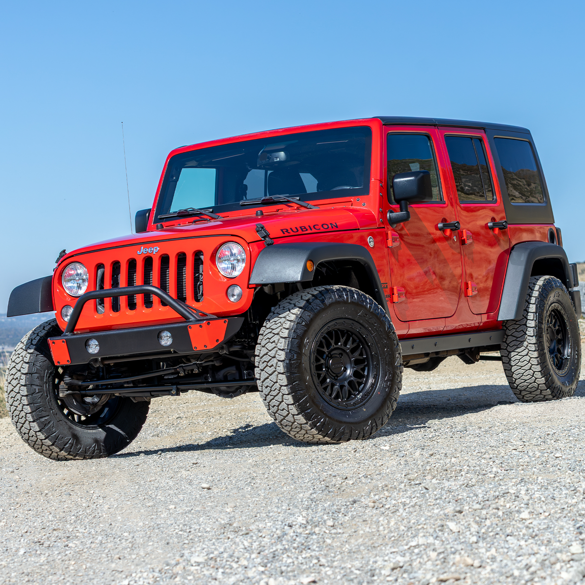 Savvy Offroad Surf & Turf bumper with hoop and fog lights installed in custom-cut bumper skin openings