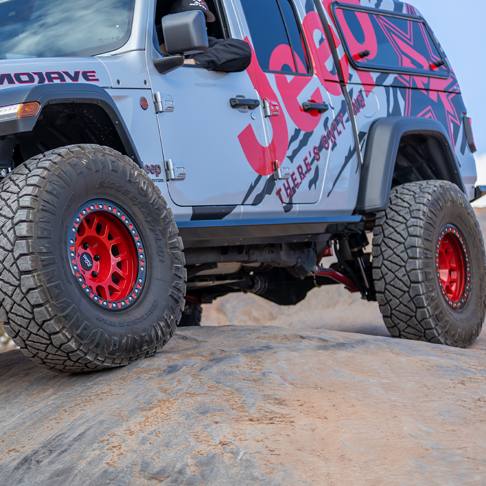 High-clearance weld-on Jeep JT rock sliders with replaceable outer skin
