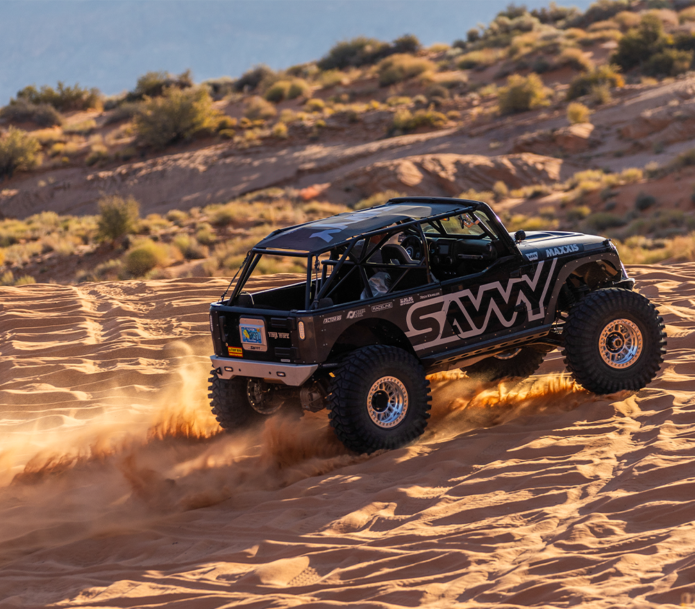 Jeep Wrangler JKU using Savvy KRAWLER LITE front bumper, rear bumper, and bolt-on sliders on an off-road trail