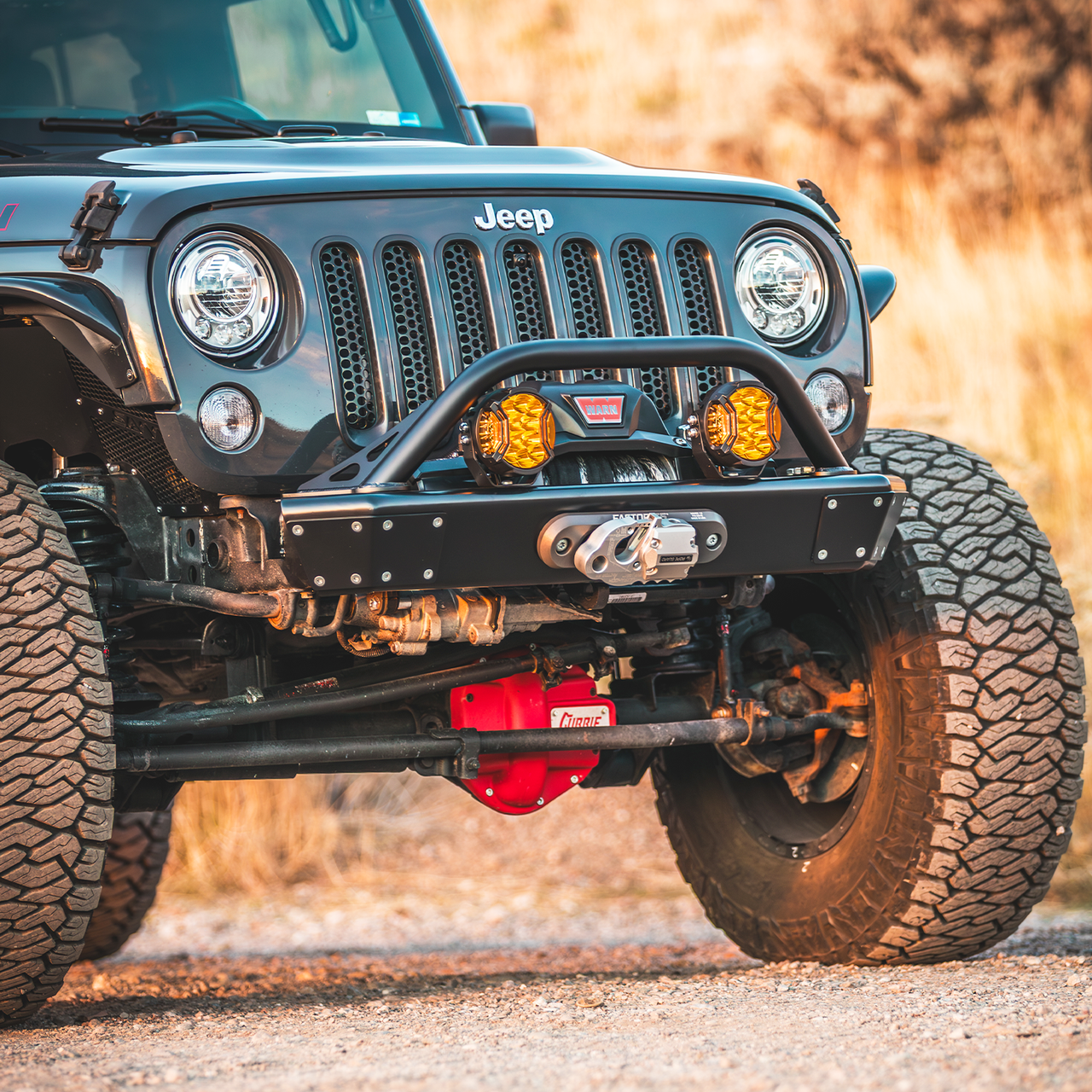 Jeep Wrangler JKU with complete Savvy LEGACY ELITE armor bundle installed including 6061 aluminum bumpers, sliders, inner fenders, rocker trim, and spare tire delete