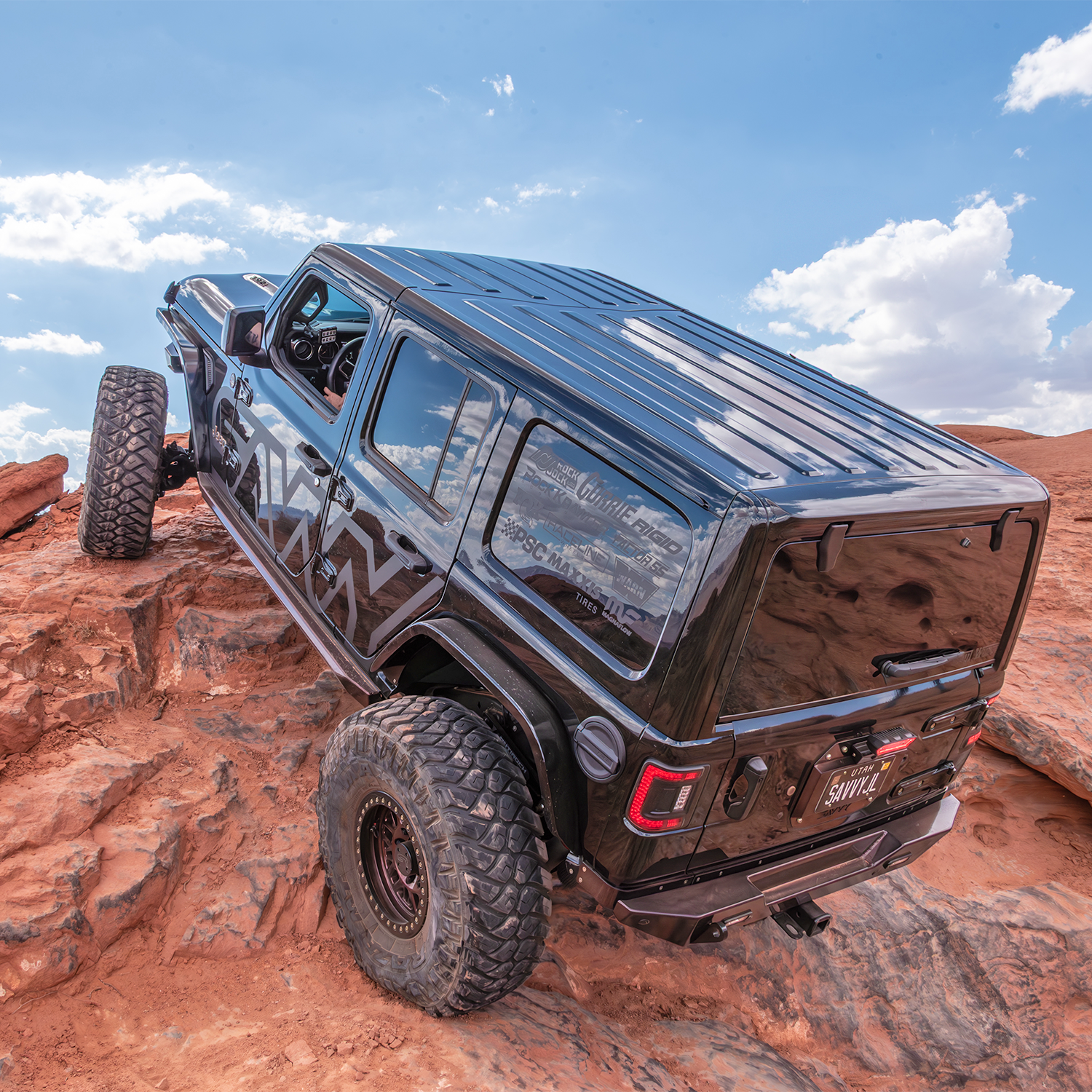 Jeep Wrangler JLU using Savvy KRAWLER ELITE armor bundle on an off-road trail with high-clearance bumpers, sliders, and inner fenders