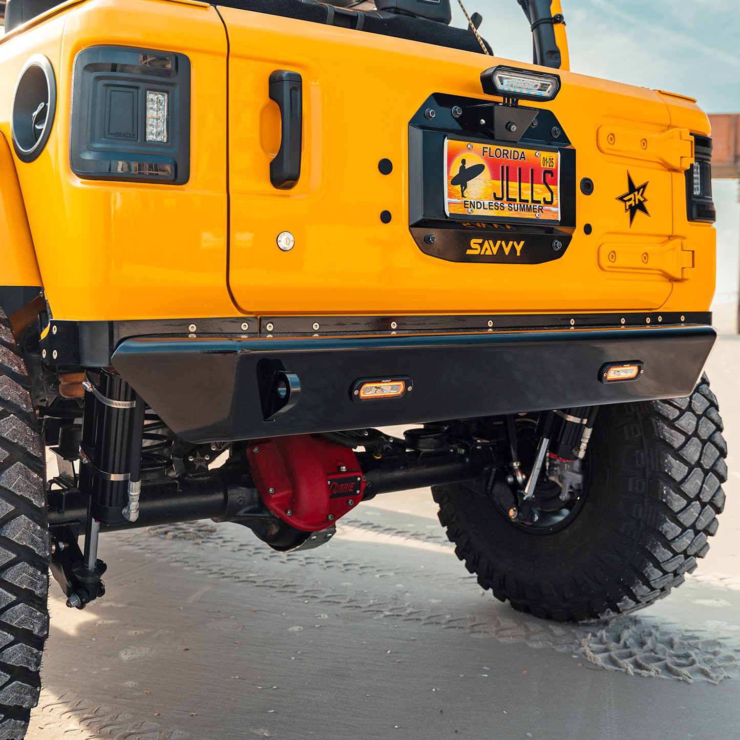 Jeep Wrangler JLU with complete Savvy LEGACY ELITE armor bundle installed including 6061 aluminum bumpers, sliders, inner fenders, trim kits, and spare tire delete