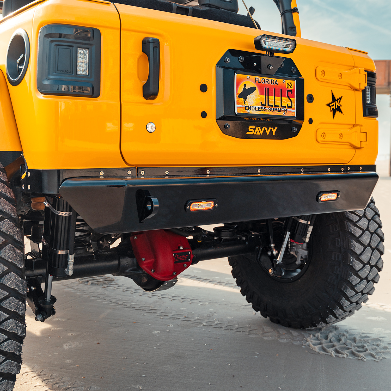 Jeep Wrangler JLU with complete Savvy LEGACY ELITE armor bundle installed including 6061 aluminum bumpers, sliders, inner fenders, trim kits, and spare tire delete