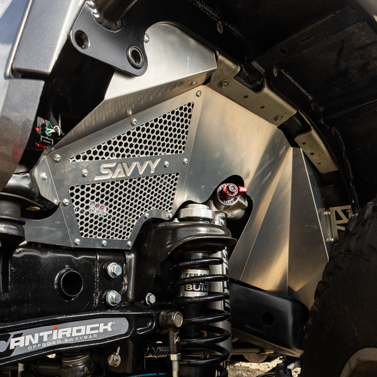 Savvy Offroad high-clearance vented 16-gauge aluminum front inner fenders built for 40-inch-plus tires with coilover-friendly trimmable design on 2007–2018 Jeep Wrangler JKU