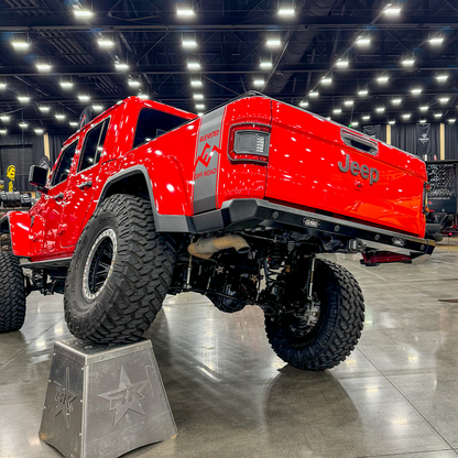 Detail view of Savvy Offroad KRAWLER ELITE Jeep Gladiator JT rear bumper showing replaceable 5052 aluminum skin, end caps, and license plate relocation with LED lights