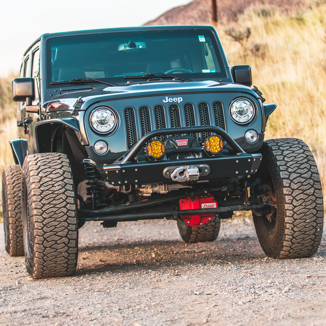 Savvy Offroad LEGACY 6061 aluminum front bumper with hoop featuring 8-pound aluminum skin, 3/16-inch steel winch plate, and front hoop protecting grille and lighting on 2007–2018 Jeep Wrangler JKU