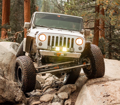 Jeep Wrangler JK/JKU equipped with Savvy Offroad LEGACY 6061 aluminum front and rear bumpers navigating extreme rock crawling and off-road terrain