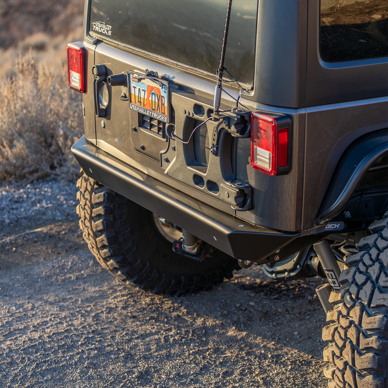 Savvy Offroad LEGACY 6061 Jeep JKU rear bumper showing new 3/16-inch steel high-clearance crossmember with integrated low-profile D-ring recovery mounts for secure winching